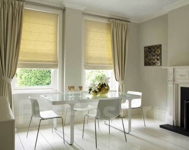 Modern options for window decor: rolletes and curtains.